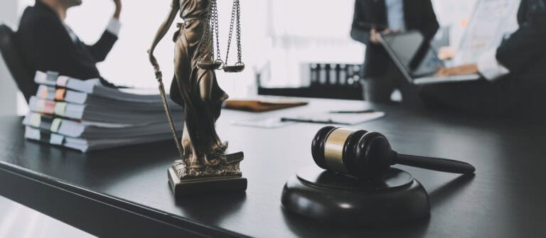 consultation and conference of male lawyers and professional businesswoman working and discussion having at law firm in office. concepts of law, judge gavel with scales of justice.